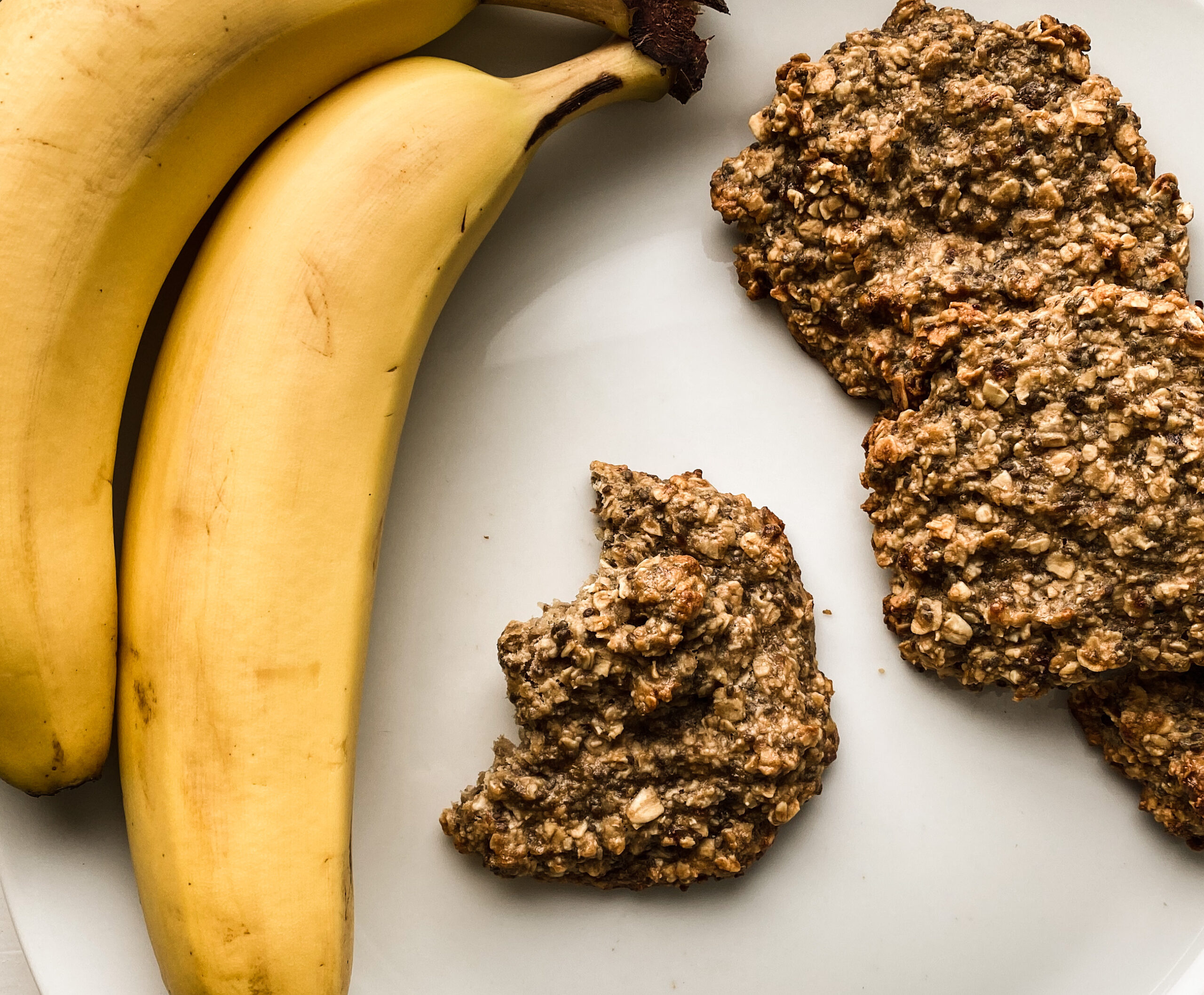 Bananas and banana bread cookies on parchment paper